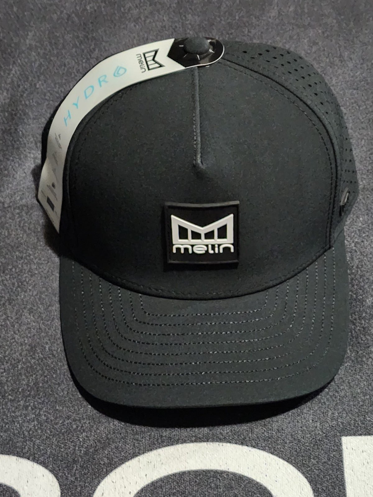 Melin Hydro Odyssey Stacked Black Classic Fit Hat Cziuf