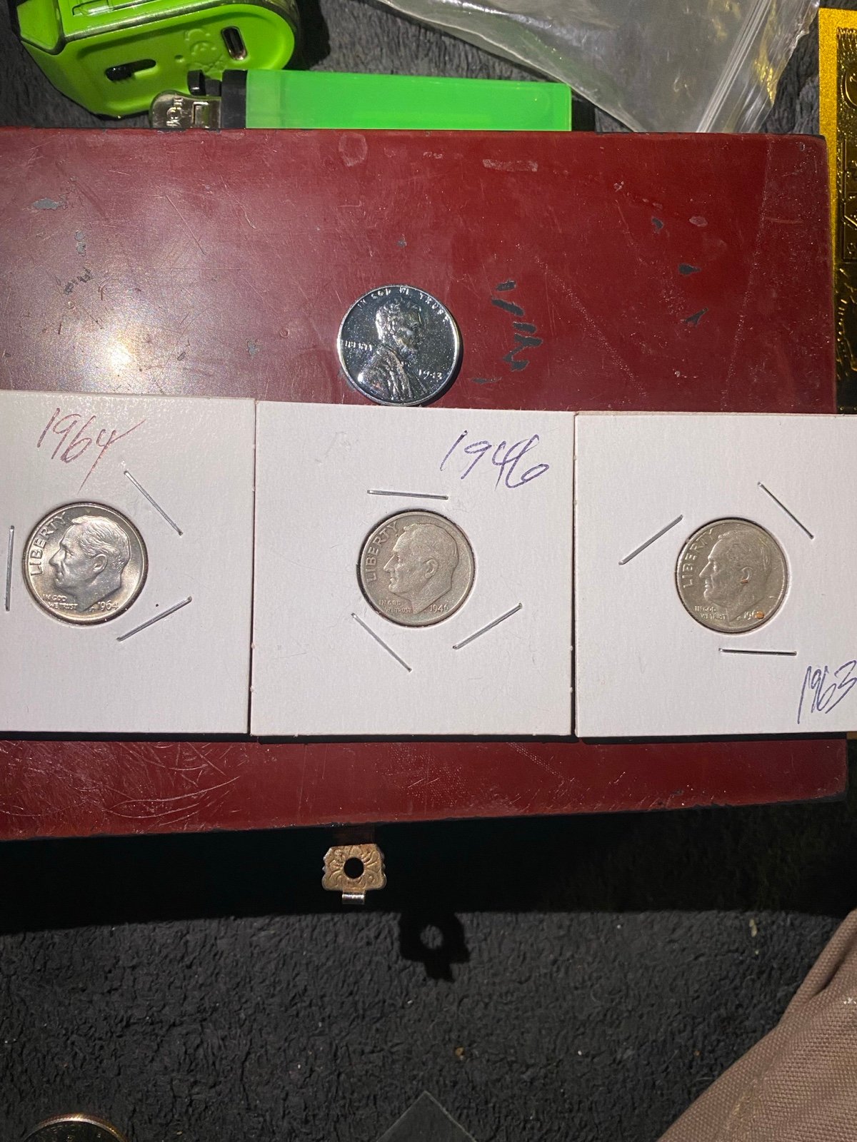 Three Roosevelt, Silver dimes, 1963, 1946 and 1964, and one still penny, 1943 FHWx540GU