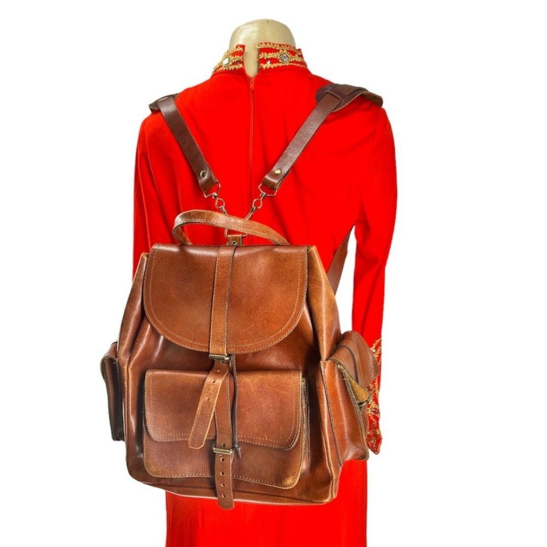 Artisan crafted cognac brown leather backpack with remo